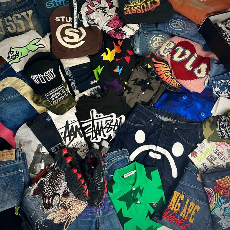 Flat lay of curated streetwear, denim, footwear and accessories
